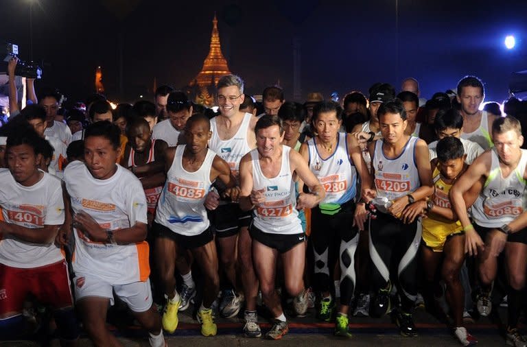 Runners take off at the start of Myanmar's first international marathon in decades in Yangon, on January 27, 2013. Hundreds of runners streamed through Yangon on Sunday for Myanmar's first international marathon in decades, in another sign of the dramatic changes sweeping the former army-ruled country