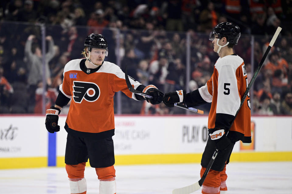 Philadelphia Flyers' Owen Tippett, left, celebrates his goal against the Dallas Stars with Egor Zamula (5) during the second period of an NHL hockey game Thursday, Jan. 18, 2024, in Philadelphia. (AP Photo/Derik Hamilton)