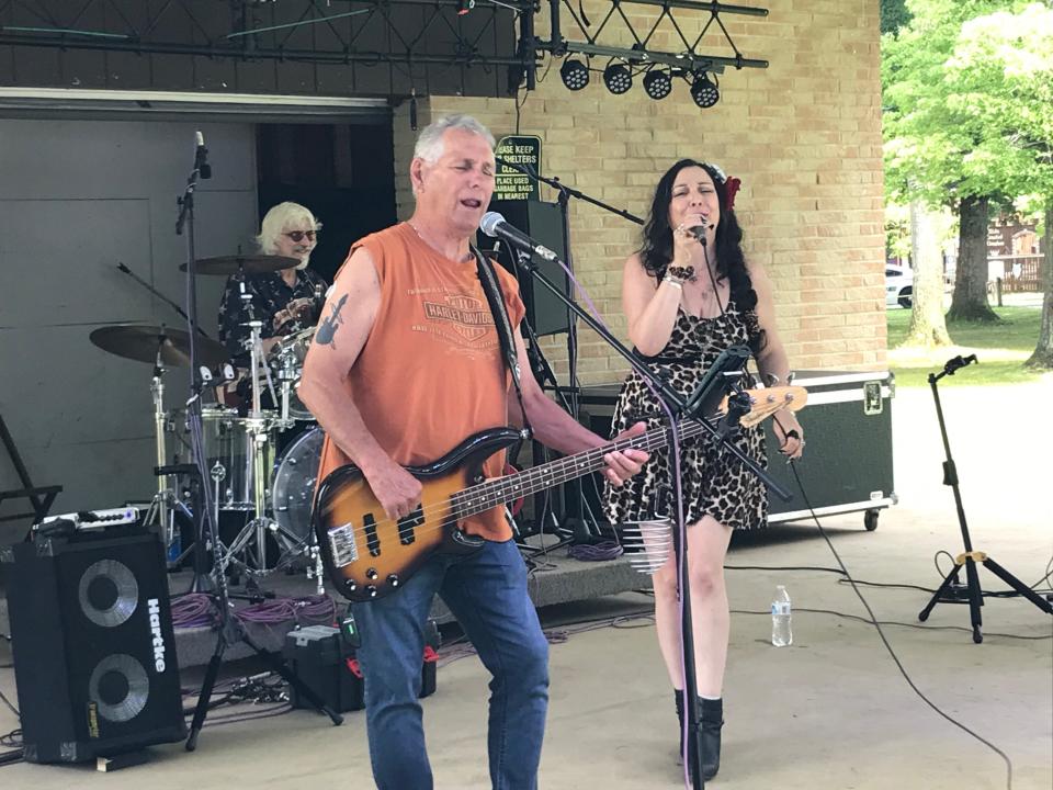 Hat Trick band members Ray Fernandez (bass guitar), Dena Miller (vocals), Jimi Miller (drums) at Ewing Park on July 1. Not in photo is guitarist Randy Catalogna.