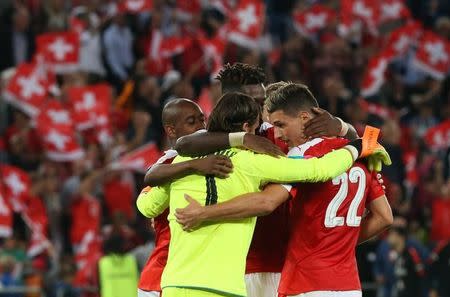 Football Soccer - Switzerland v Portugal - 2018 World Cup Qualifier - St. Jakob-Park, Basel, Switzerland - 6/9/16. Switzerland's goalkeeper Yann Sommer, Gelson Fernandes, Johan Djourou and Fabian Schaer celebrate after defeating Portugal. REUTERS/Ruben Sprich