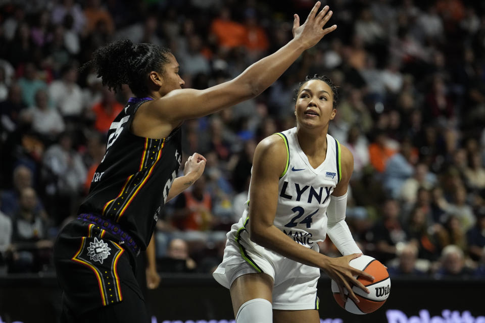 Alyssa Thomas defends Napheesa Collier in Game 4. (Joe Buglewicz/Getty Images)