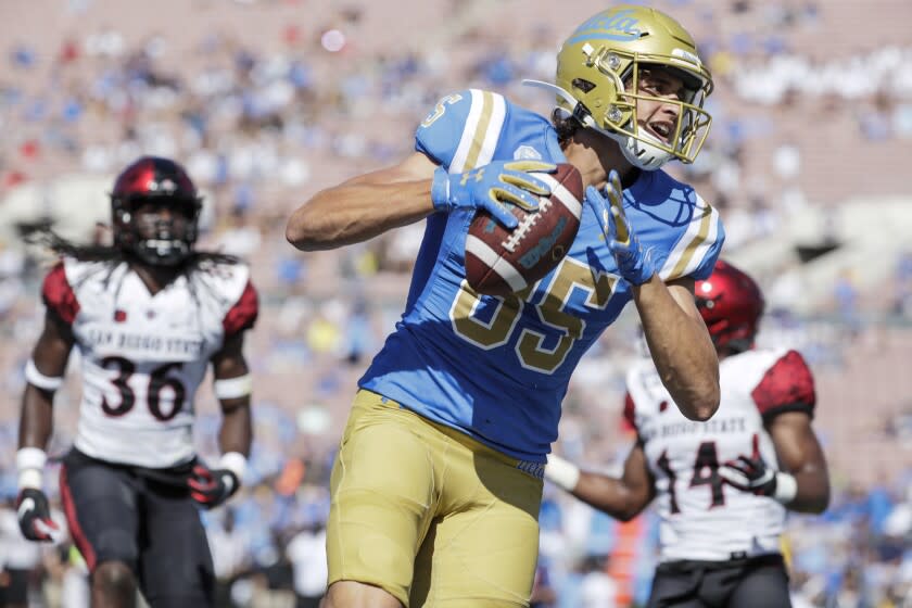 UCLA tight end Greg Dulcich scores a touchdown in the third quarter.