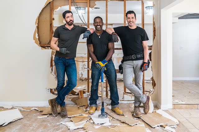 <p>HGTV</p> Sterling K. Brown poses beside Drew and Jonathan Scott on the season finale of 'Celebrity IOU.'