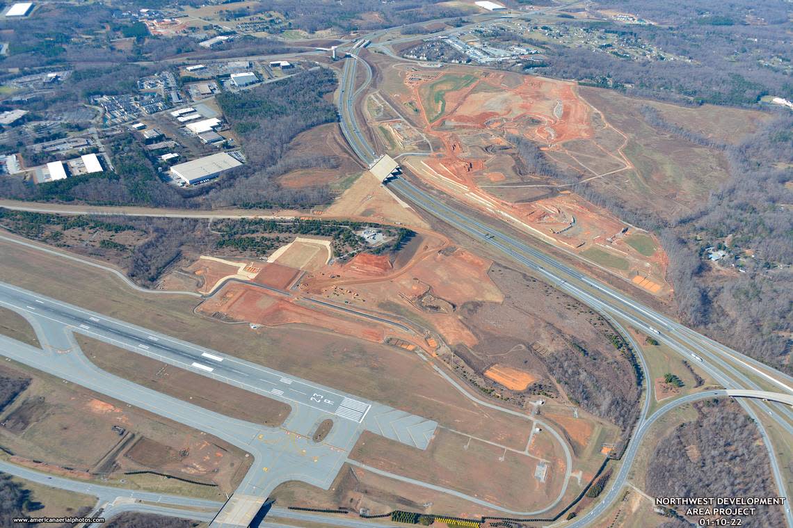 Boom Supersonic will build a jet factory on 65 acres between a runway at Piedmont Triad International Airport and Interstate 73, right. The white bridge over the interstate was built so planes can someday taxi to property the airport hopes to develop for aerospace companies across the highway. Piedmont Triad International Airport