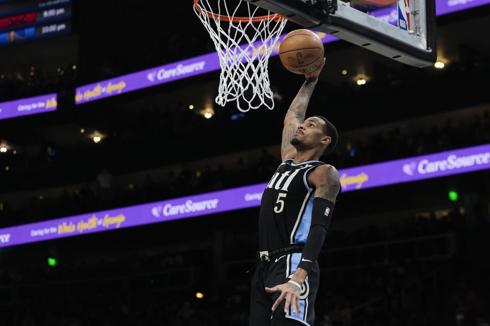 Atlanta Hawks guard Dejounte Murray (5) scores in the half of an NBA basketball game against the Los Angeles LakersTuesday, Jan. 30, 2024, in Atlanta. (AP Photo/John Bazemore)