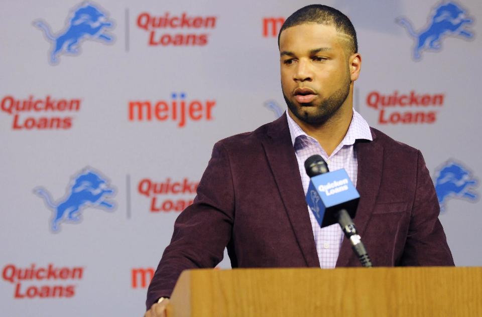 Newly-signed Detroit Lions wide receiver Golden Tate talks with the media about his contract at The Detroit Lions headquarters in Allen Park, Mich., on Wednesday, March 11, 2014. (AP Photo/Detroit News, Elizabeth Conley)