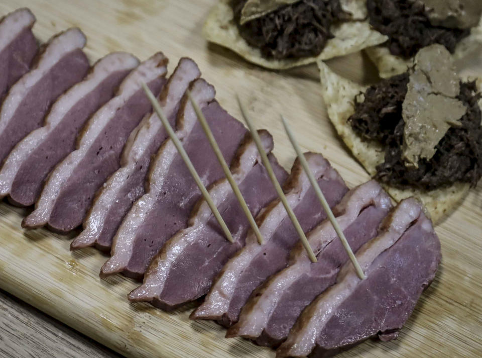 CORRECTS TO HUDSON VALLEY FOIE GRAS INSTEAD OF HIDDEN VALLEY FOIE GRAS This July 18, 2019 photo shows samples of foie gras delicacy from ducks farmed at Hudson Valley Foie Gras duck farm in Ferndale, N.Y. A New York City proposal to ban the sale of foie gras, the fattened liver of a duck or goose, has the backing of animal welfare advocates, but could mean trouble for farms outside the city that are the premier U.S. producers of the French delicacy. (AP Photo/Bebeto Matthews)