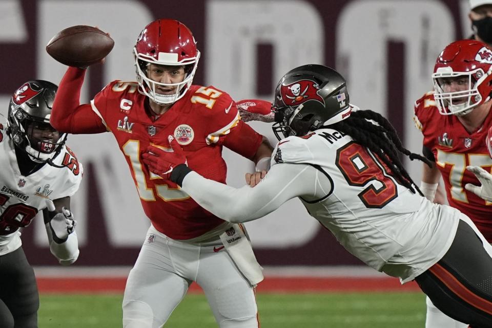 Kansas City Chiefs quarterback Patrick Mahomes is pressured by Tampa Bay Buccaneers nose tackle Steve McLendon pressures.