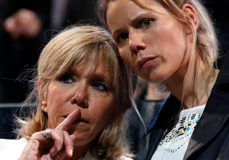 Brigitte Trogneux (L), wife of Emmanuel Macron, head of the political movement En Marche !, or Onwards !, and candidate for the 2017 presidential election, and her daughter Tiphaine attend a political rally in Paris, France, April 17, 2017. REUTERS/Christian Hartmann