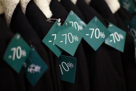 Discount sale tags are seen on clothes at a department store in Paris on the first day of the winter sales in France, January 6, 2016. REUTERS/Benoit Tessier/File Photo