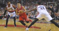 Houston Rockets' Jeremy Lin (7) drives against Portland Trail Blazers' Thomas Robinson (41) and Mo Williams (25) during the first half of game six of an NBA basketball first-round playoff series game in Portland, Ore., Friday May 2, 2014. (AP Photo/Greg Wahl-Stephens)