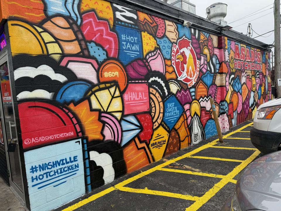 A colorful mural is shown on the side of Asad's Hot Chicken restaurant, which recently opened on Route 130 in Burlington City.