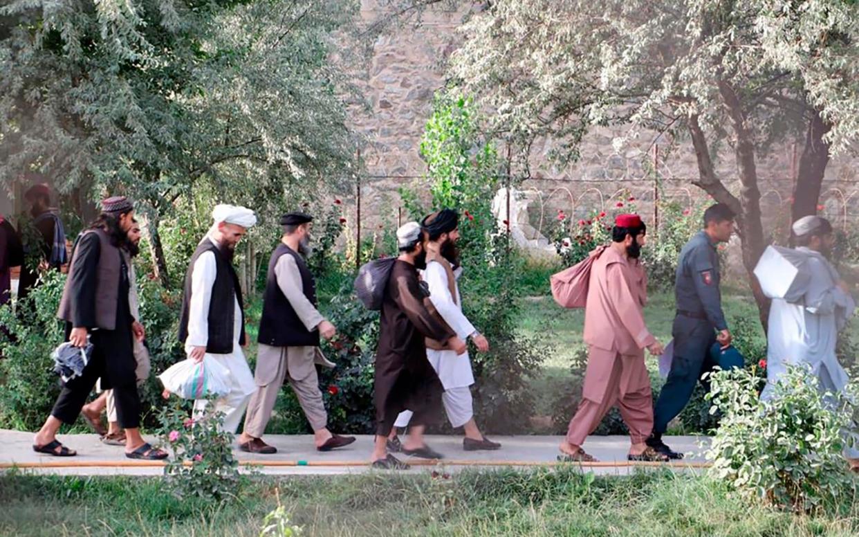 Taliban prisoners are released from Pul-e-Charkhi jail in Kabul, Afghanistan, Thursday, Aug. 13, 2020. Afghanistan released the first 80 of a final 400 Taliban prisoners, paving the way for negotiations between the warring sides in Afghanistanâ€™s protracted conflict, the government said Friday, Aug. 14, 2020. (Afghanistan's National Security Council via AP)