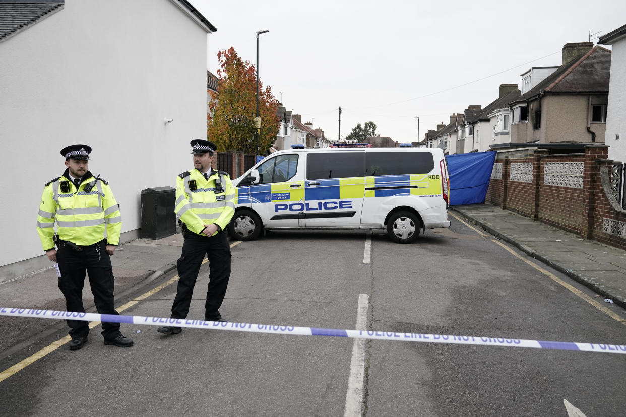 Metropolitan Police officers at the scene of a house fire on Hamilton Road in Bexleyheath, south-east London, where two children and two women died on Thursday evening. Picture date: Friday November 19, 2021.
