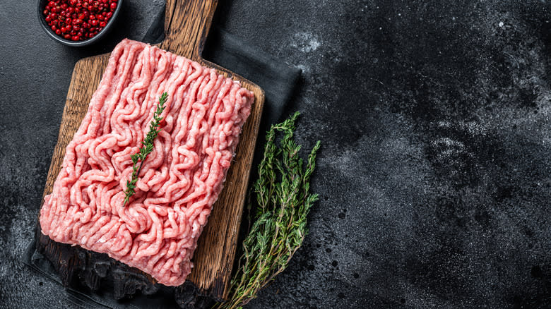 Ground turkey on wooden board