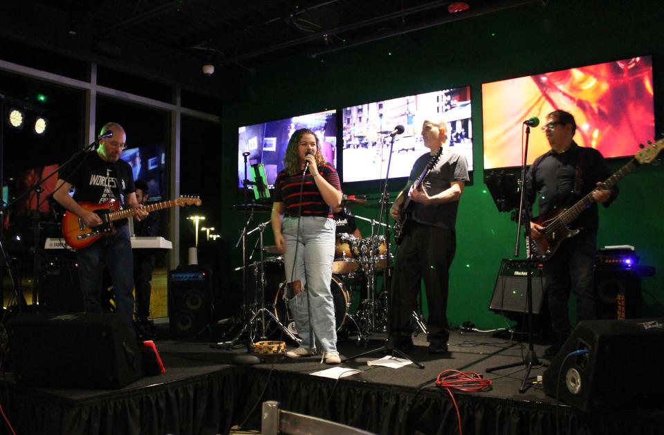 Nathan Lawson, Olivia Brenner, Frank Spicola and Paul Alves perform at Longplex Family & Sports Center in Tiverton on Saturday, Nov. 27, 2021. Other band members include B.J. Silva, Ben Lawson and Jay Borden.