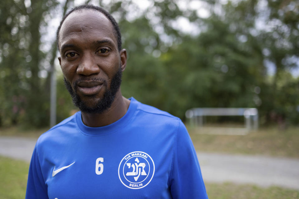 Makkabi Berlin player and youth team coordinator Papa Alpha Diop during an interview with The Associated Press, in Berlin, Tuesday, July 25, 2023. When Makkabi Berlin takes the field on Sunday Aug. 13, 2023, the soccer club founded by Holocaust survivors will become the first Jewish team to play in the German Cup. (AP Photo/Ciaran Fahey)