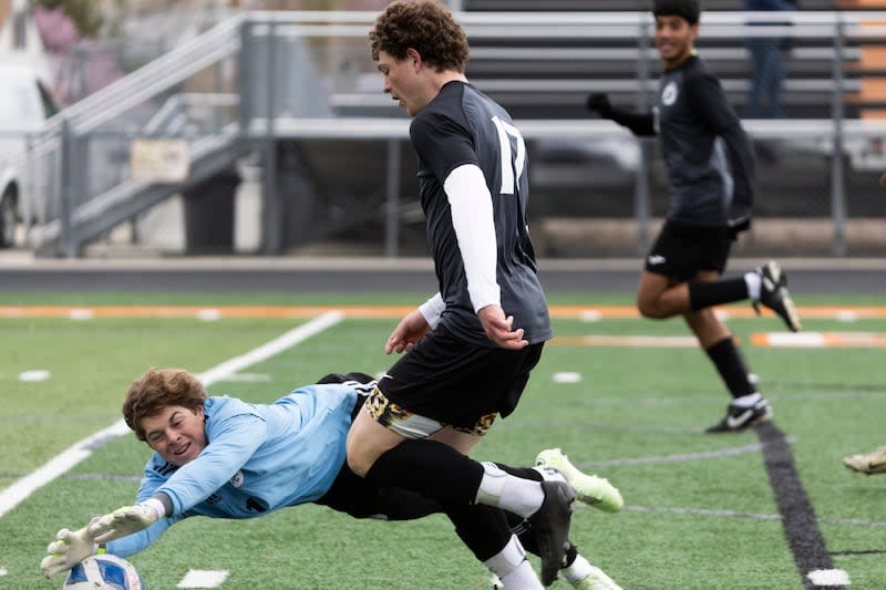 Park City Miners goalkeeper Joseph Croney (1) blocks the ball from Murray Spartans Dillon Curtis (17) during a game at Murray High School in Murray on Friday, April 5, 2024.