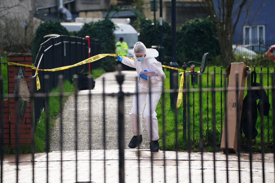 Police and forensic officers at Rawnsley Park near to the scene in the St Philips area of Bristol where a 16-year-old boy has died after being stabbed on Wednesday evening (PA)