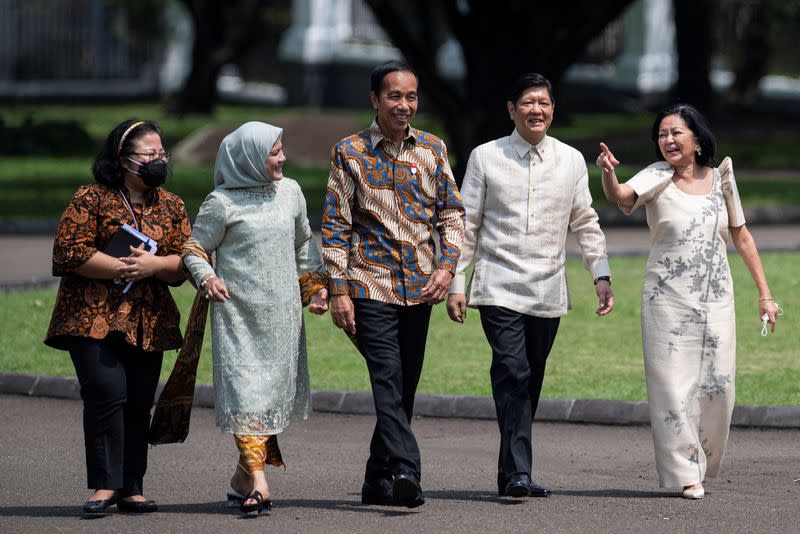 Philippine President Ferdinand "Bongbong" Marcos Jr. and his wife Louise Araneta-Marcos talk to Indonesian President Joko Widodo and wife Iriana Joko Widodo during their meeting at Presidential Palace in Bogor