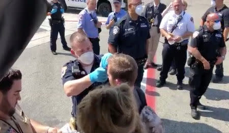 Passengers are assisted by the air cabin crew and the emergency services on a flight from New York to Dubai, at JFK Airport, New York, U.S., September 05, 2018 in this still image obtained from a social media video. ERIN SYKES/via REUTERS THIS IMAGE HAS BEEN SUPPLIED BY A THIRD PARTY. MANDATORY CREDIT. NO RESALES. NO ARCHIVES.