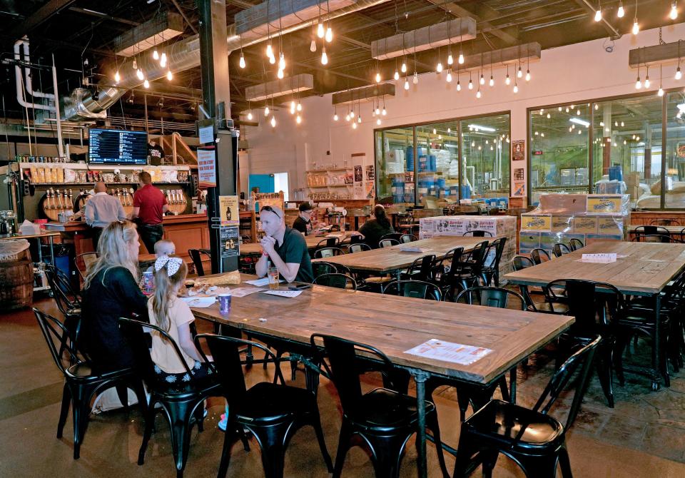 Visitors enjoy beer and soda in the tap room at Sprecher Brewing Co. on June 7, 2023.