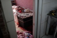 Blood covers the floor and a bed inside a home during a police operation targeting drug traffickers in the Jacarezinho favela of Rio de Janeiro, Brazil, Thursday, May 6, 2021. At least 25 people died including one police officer and 24 suspects, according to the press office of Rio's civil police. (AP Photo/Silvia Izquierdo)
