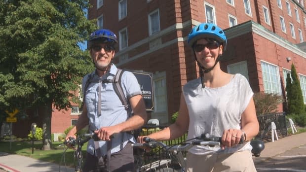 Harnys and Christine Chartier decided on a cycling tour of the Maritimes this fall rather than a vacation in Western Canada. (Laura Meader/CBC - image credit)