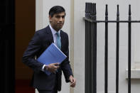 Britain's Chancellor Rishi Sunak leaves Downing Street to attend Parliament in London, Wednesday, Nov. 25, 2020. Britain's Treasury chief is set to tell lawmakers later Wednesday that the deterioration in the public finances has been worse than at any time since wartime, but that now is not the time to announce widespread spending cuts and tax rises. (AP Photo/Kirsty Wigglesworth)