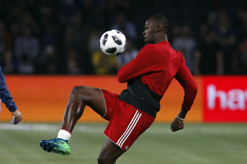 Usain Bolt, seen here prepping for a June charity soccer match in France, hopes to have a second act as a professional soccer player. (AP)