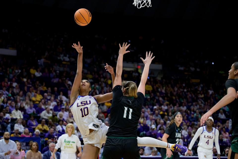LSU forward Angel Reese (10) shoots against Hawaii forward Kallin Spiller (11) during the second half of a first-round college basketball game in the women's NCAA Tournament in Baton Rouge, La., Friday, March 17, 2023. (AP Photo/Matthew Hinton)