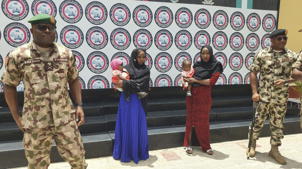 Recently freed Chibok school girls with their children are photographed at the Army Maimalari Cantonment in Maiduguri, Nigeria, Thursday, May. 4, 2023. Two Nigerian schoolgirls have been rescued after nine years in the capacity of a Jihadi militant group, the West African nation's military said Thursday. One girl had a baby while the second was pregnant and gave birth days after her freedom. (AP Photo/Jossy Ola)