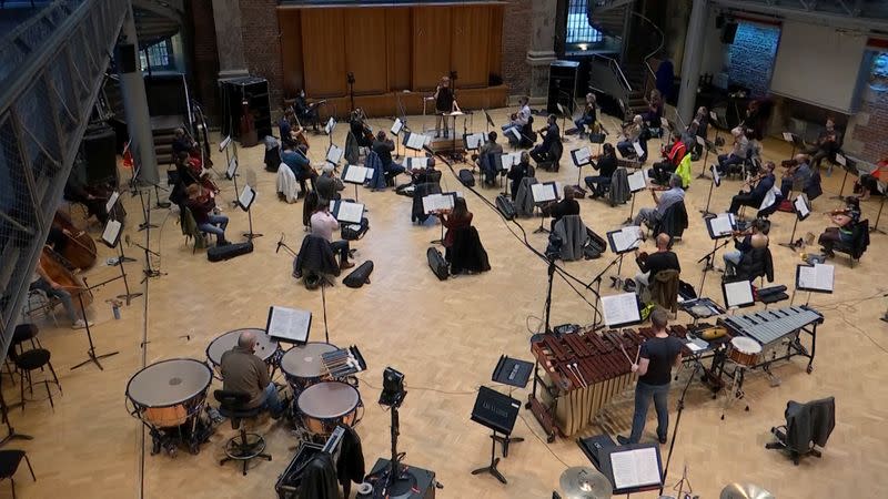 A socially-distanced London Symphony Orchestra rehearse in London