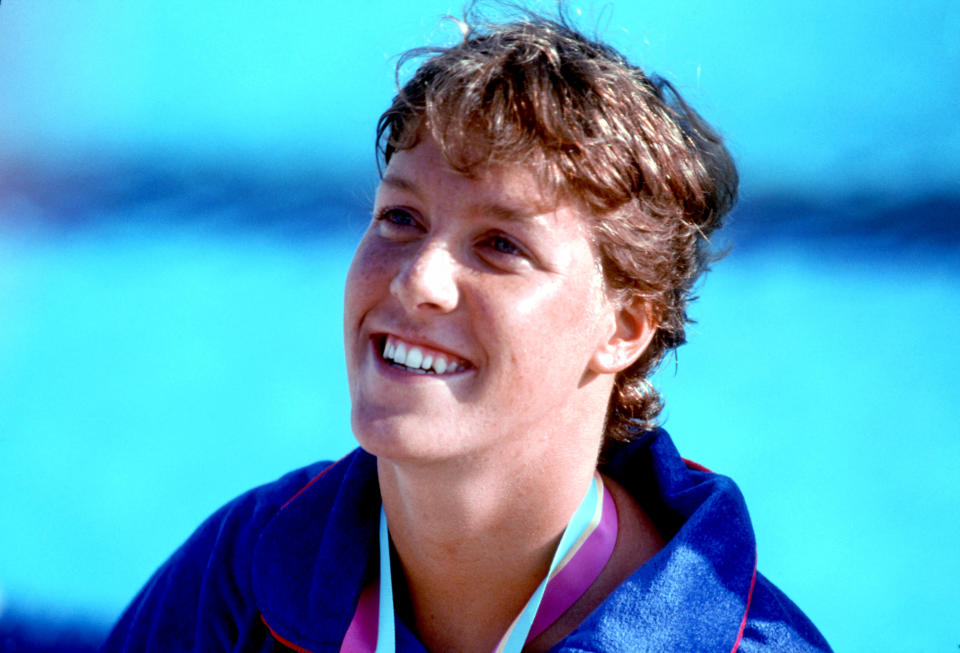 Tracy Caulkins smiles after being presented with a gold medal. 