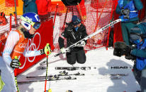 Heinz Haemmerle, or "Magic Heinzi" as US skier Lindsey Vonn calls her Austrian-born ski technician, checks the skis of the world's most successful skiing woman before the start of Vonn's third Olympic Downhill training run at the Winter Olympics 2018 in Pyeongchang, South Korea February 20, 2018. REUTERS/Leonhard Foeger