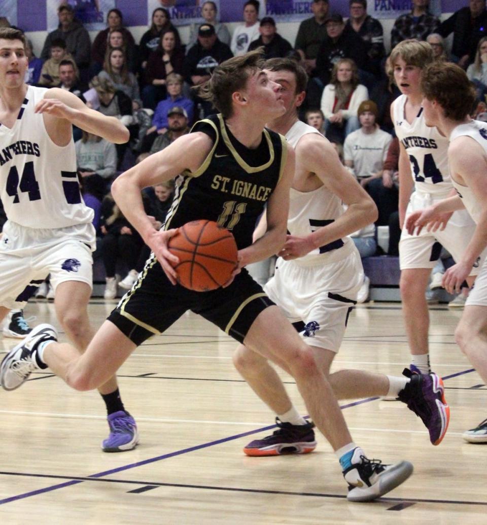 St. Ignace sophomore guard Jonny Ingalls drives to the basket during the second quarter of St. Ignace's 84-70 win over the Pickford Panthers on Tuesday night. Ingalls led the Saints with 21 points.
