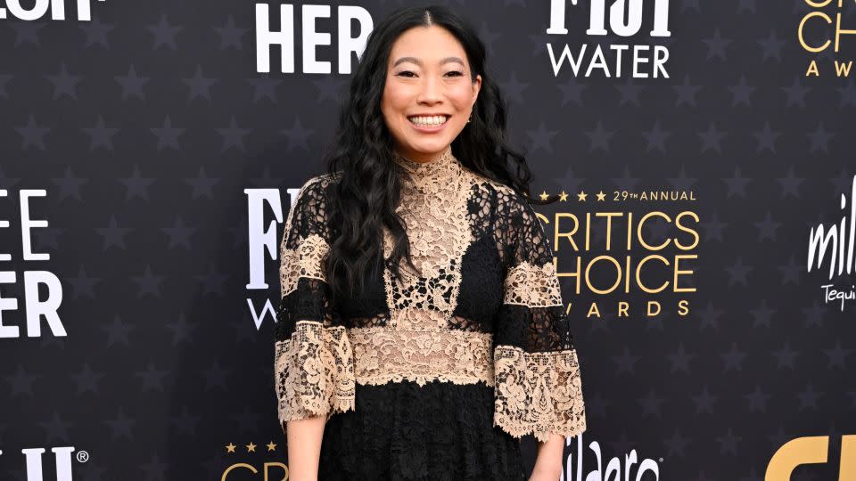 Rapper and actress Awkwafina looked elegant in a two-tone lace Dior Haute Couture dress. - Gilbert Flores/Variety/Getty Images