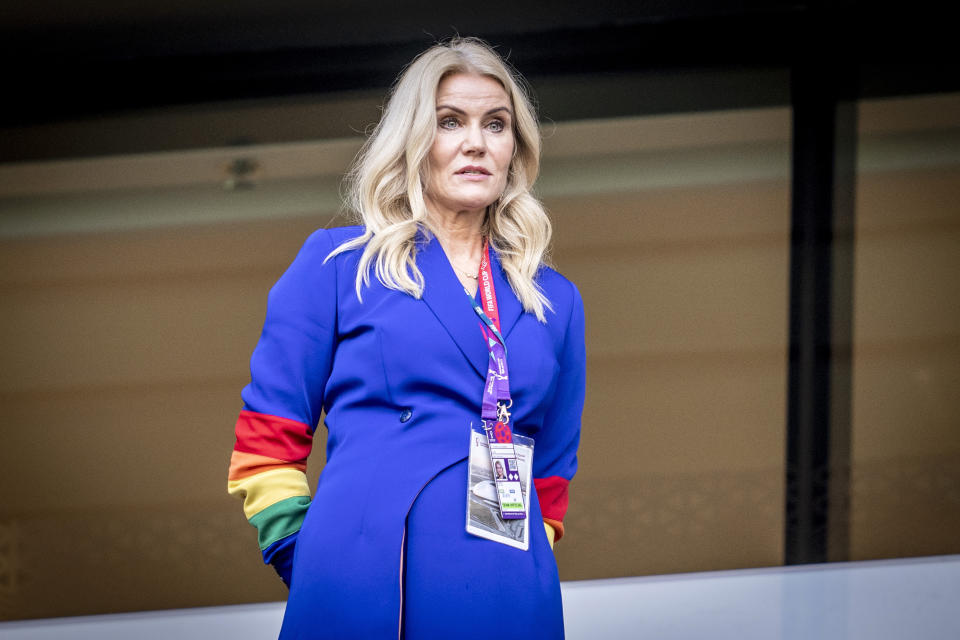 Former Danish Prime Minister Helle Thorning-Schmidt wears a rainbow-colored armband before a World Cup group D soccer match between Denmark and Tunisia, at the Education City Stadium, in Doha, Qatar, Tuesday, Nov, 22, 2022. (Mads Claus Rasmussen/Ritzau Scanpix via AP)