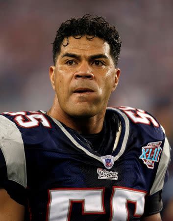 FILE PHOTO - New England Patriots linebacker Junior Seau looks on before the start of the NFL's Super Bowl XLII football game against the New York Giants in Glendale, Arizona, U.S. on February 3, 2008. REUTERS/Mike Blake/File Photo