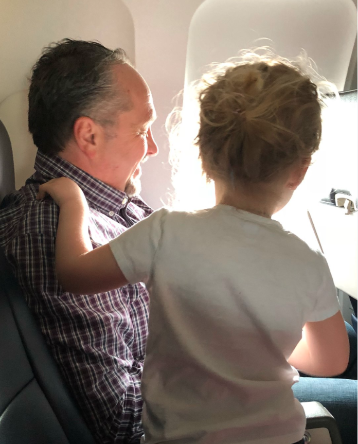 By the end of the flight, Jessica's daughter and the man seated next to them were the best of friends. Photo: Facebook/Jessica Rudeen