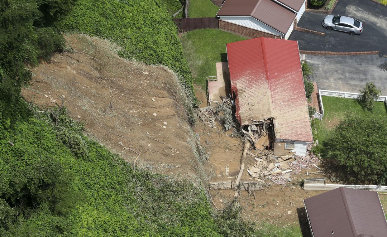 In this aerial photo residents of Whitesburg, Ky., are beginning to return to the small city in the eastern part of the state, Saturday, July 30, 2022. The area is beginning to asses the damage after historic rain brought catastrophic flooding to the area killing multiple people.