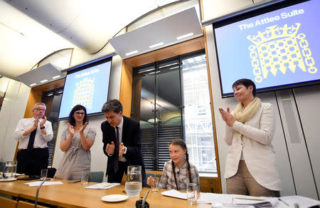 Swedish environmental activist Greta Thunberg receives applause as she gives a speech at the House of Commons as a guest of Caroline Lucas, in London, Britain April 23, 2019. REUTERS/Toby Melville