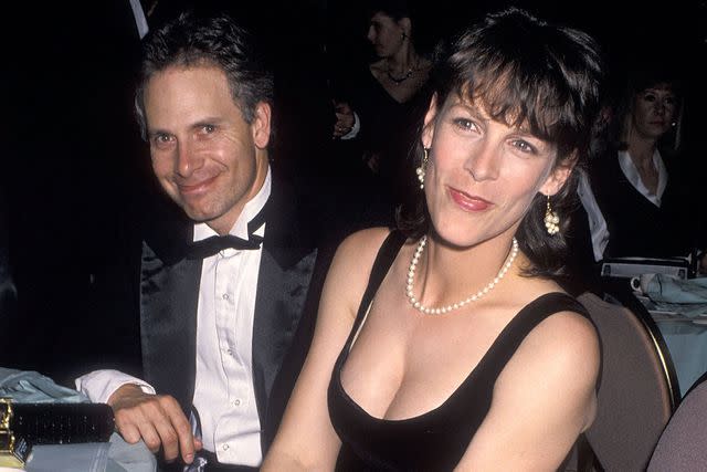 <p>Ron Galella/Ron Galella Collection via Getty</p> Christopher Guest and Jamie Lee Curtis, Directors Guild of America Awards, March 1989