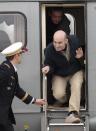 Released French hostage Nicolas Henin arrives at the Villacoublay military airbase, outside Paris, Sunday April 20, 2014. Henin and three other French journalists kidnapped and held for 10 months in Syria returned home on Sunday to joyful families awaiting them. The four were freed by their captives a day earlier at the Turkish border. (AP Photo/Jacques Brinon)