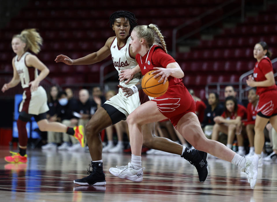 Louisville guard Hailey Van Lith (10) drives against Boston College forward Taylor Soule (13) during the second half of an NCAA college basketball game, Sunday, Jan. 16, 2022, in Boston. (AP Photo/Mary Schwalm)