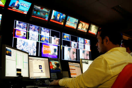 An employee works at the control room of the Geo News television channel in Karachi, Pakistan April 11, 2018. Picture taken April 11, 2018. REUTERS/Akhtar Soomro