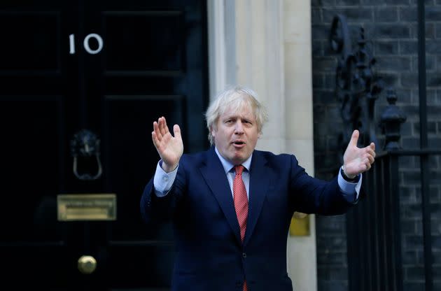 Boris Johnson applauds on the doorstep of 10 Downing Street in London during the weekly Clap for our Carers. 