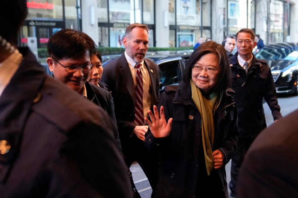 Taiwan’s president Tsai Ing-wen waves as she arrives at a hotel, in New York (AP)