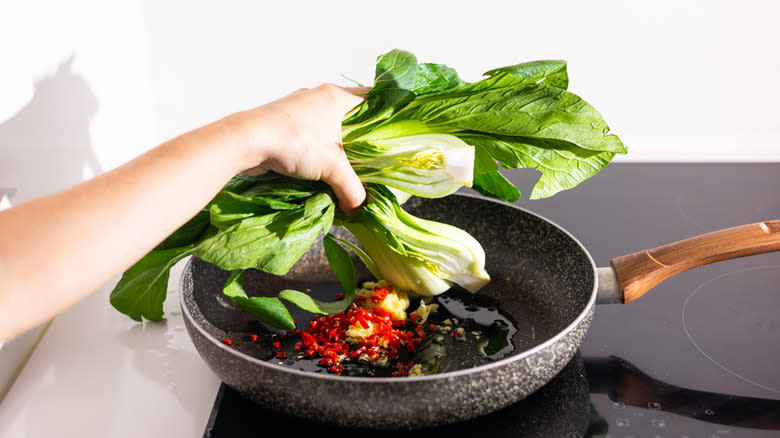 adding bok choy to pan