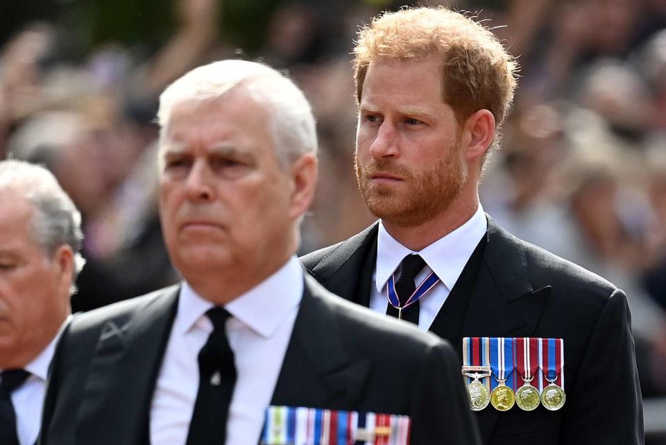 <p>Kate Green/Getty</p> Prince Andrew and Prince Harry walk behind Queen Elizabeth